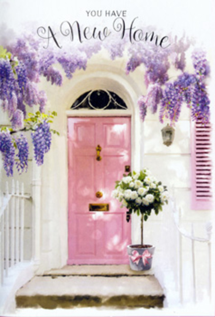 In this photograph, a tranquil Alperton doorway has been turned into a tender tribute to new beginnings, using only the softest tones and natural textures. The front door stands at the centre, painted in a gentle, dusty pink that feels modern yet timeless, likely not far from the calm residential streets surrounding Ealing Road or the quieter flats near the Grand Union Canal. Its panels catch the light in subtle ridges, adding a hint of dimension, while the neighbouring wall is whitewashed, lending brightness and clarity to the scene. A single, pale shutter to one side echoes the softness of the palette, suggesting a cosy interior beyond. Above the door, lush wisteria pours down in a cascade of lavender blossoms. Each cluster of petals hangs in elongated sprays, some densely gathered, others looser and more transparent, allowing slivers of daylight to pass through and cast patterned shadows on the facade. The flowers appear plush yet delicate, their hues ranging from muted lilac to near-white, conjuring the impression of gentle fragrance drifting along an Alperton side street. At the base of the door rests a grey metal bucket, sturdy and unadorned except for the carefully tied satin ribbon around its middle. Inside, a generous bouquet of creamy and white roses is arranged with confident artistry, their full, layered petals overlapping in soft, cloud-like forms. Sprigs of green foliage weave between the blooms, some leaves smooth and glossy, others more textured and muted, creating a balanced, organic feel. The ribbon, in a pastel pink that harmonises with the door, is tied into a relaxed bow, its ends resting on the step like a quiet flourish. The overall mood is one of calm optimism and heartfelt welcome-the kind of floral scene that could greet someone arriving home in Alperton for the first time, offering both congratulations and the soothing reassurance that they are exactly where they need to be.