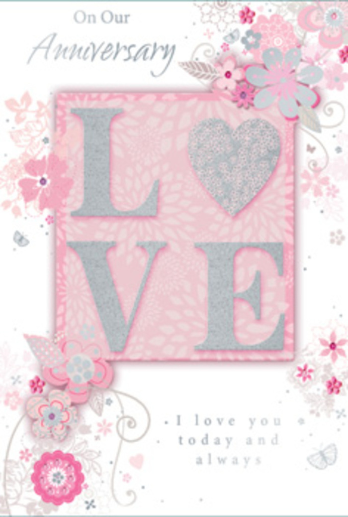 The anniversary card here is composed with the same care and balance a florist might give to a favourite hand-tied bouquet in Alperton. At the centre of the design, the word LOVE appears in raised, frosted glitter, giving each letter a distinctive texture that invites the fingertips to explore. The glitter reflects light softly, creating a subtle, pearly glow rather than a harsh sparkle, and the letters sit within a pale, blush-pink field that suggests soft light at the close of day. Around the central text, wispy, hand-drawn flowers and airy sprays of foliage float along the edges and corners. These blooms are shaded in a gentle harmony of pink, lilac, and ivory, their petals slightly translucent, as though painted with a light touch of watercolour. The fine line work that defines stems and leaves curves gracefully, echoing the arcs and spirals a florist's ribbon might make when tied around a bouquet destined for a home near Alperton Station. Interwoven among the blossoms are slender filigree flourishes and tiny, nearly hidden butterflies, their wings shaped with just a few careful strokes, giving the impression of movement without disrupting the card's calm. The phrase I love you today and always is set beneath the main motif in an understated, well-spaced type, its quiet presence encouraging a pause for reflection. Overall, the card projects a sense of gentle gratitude and enduring devotion, like a fresh arrangement placed in a favourite vase on the table. It feels less like a simple greeting and more like a bouquet captured in paper, created to honour the continuity of love in the everyday life of Alperton couples.